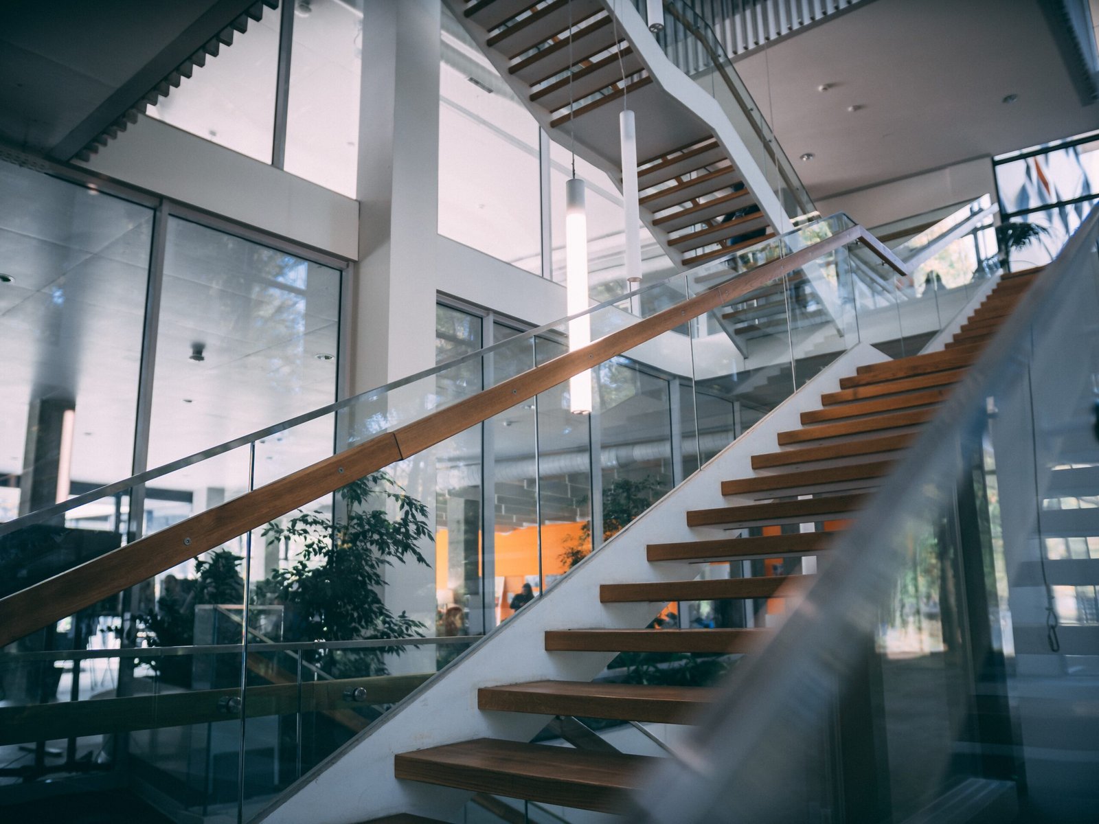 Commercial Renovation 5 modern room with wooden staircase daytime scaled